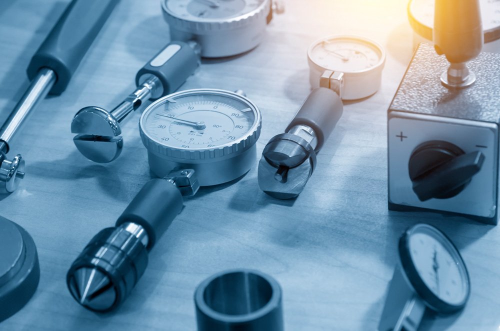 Dial indicator on calibration bench — Allometrics offers in-house micrometer repair so most instruments don't get rejected and shipped back